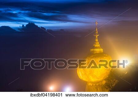 Illuminated Golden Rock at night with Kyaiktiyo Pagoda, Kyaikto, Thaton District, Mon State, Myanmar, Asia View Large Photo Image Stock Image - Illuminated Golden Rock at night with Kyaiktiyo Pagoda, Kyaikto, Thaton District, Mon State, Myanmar, Asia. Fotosearch