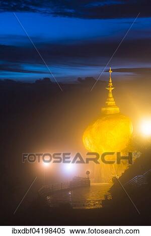 Illuminated Golden Rock at night with Kyaiktiyo Pagoda, Kyaikto, Thaton District, Mon State, Myanmar, Asia View Large Photo Image Stock Photography - Illuminated Golden Rock at night with Kyaiktiyo Pagoda, Kyaikto, Thaton District, Mon State, Myanmar, Asia. Fotosearch