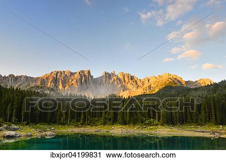 Stock Image - Karersee lake in front of Latemar, Lago di Carezza, Carezza, Dolomites, Trentino Province, Province of South Tyrol, Italy, Europe. Fotosearch