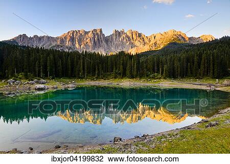 Karersee lake in front of Latemar, Lago di Carezza, Carezza, Dolomites, Trentino Province, Province of South Tyrol, Italy, Europe View Large Photo Image Stock Image - Karersee lake in front of Latemar, Lago di Carezza, Carezza, Dolomites, Trentino Province, Province of South Tyrol, Italy, Europe. Fotosearch