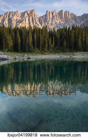 Karersee lake in front of Latemar, Lago di Carezza, Carezza, Dolomites, Trentino Province, Province of South Tyrol, Italy, Europe View Large Photo Image Stock Photo - Karersee lake in front of Latemar, Lago di Carezza, Carezza, Dolomites, Trentino Province, Province of South Tyrol, Italy, Europe. Fotosearch