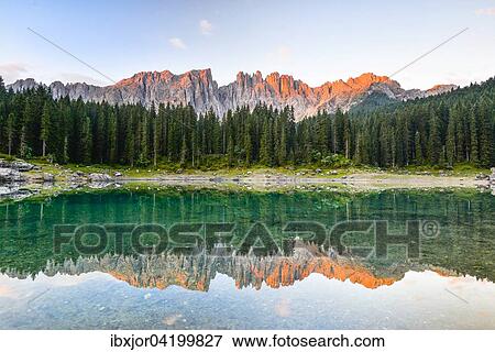 Karersee lake in front of Latemar, Lago di Carezza, Carezza, Dolomites, Trentino Province, Province of South Tyrol, Italy, Europe View Large Photo Image Stock Photo - Karersee lake in front of Latemar, Lago di Carezza, Carezza, Dolomites, Trentino Province, Province of South Tyrol, Italy, Europe. Fotosearch