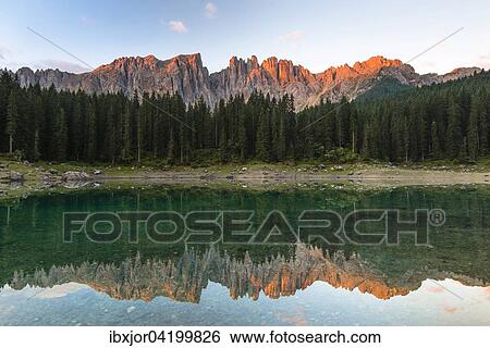 Karersee lake in front of Latemar, Lago di Carezza, Carezza, Dolomites, Trentino Province, Province of South Tyrol, Italy, Europe View Large Photo Image Stock Photograph - Karersee lake in front of Latemar, Lago di Carezza, Carezza, Dolomites, Trentino Province, Province of South Tyrol, Italy, Europe. Fotosearch