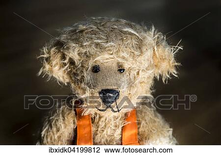 Light brown teddy bear, portrait against a dark background View Large Photo Image Stock Image - Light brown teddy bear, portrait against a dark background. Fotosearch