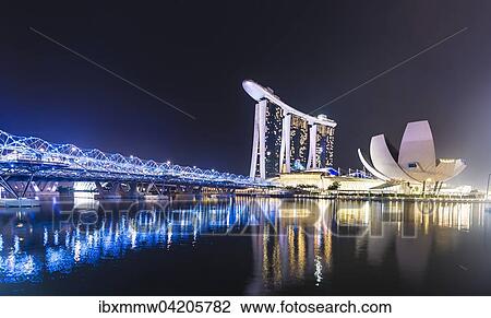 Stock Image - Light show, Millenium Bridge, Marina Bay Sands Hotel, Marina Bay, Museum of Science and Art, at night, Singapore, Asia. Fotosearch