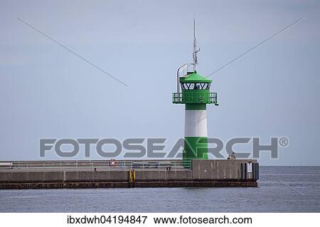 Stock Photo - Lighthouse at Nordermole, Travemunde, Lubeck, Schleswig-Holstein, Germany, Europe. Fotosearch