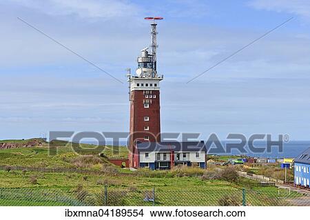 Lighthouse behind houses, against a blue sky, Heligoland, Schleswig-Holstein, Germany, Europe View Large Photo Image Picture - Lighthouse behind houses, against a blue sky, Heligoland, Schleswig-Holstein, Germany, Europe. Fotosearch