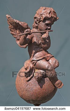 Stock Photo - Little angel figurine with flute, made of iron, Germany, Europe. Fotosearch