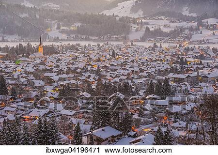 Stock Image - Oberstdorf with snow, at dusk, Allgau Alps, Allgau, Bavaria, Germany, Europe. Fotosearch