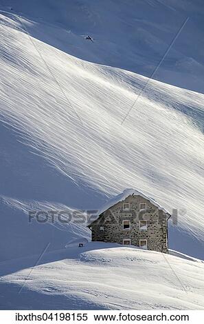 Stock Photography - Old Pforzheimer Hutte hut, 2256m, in the snow, mountains of Sesvenna, Province of South Tyrol, Italy, Europe. Fotosearch