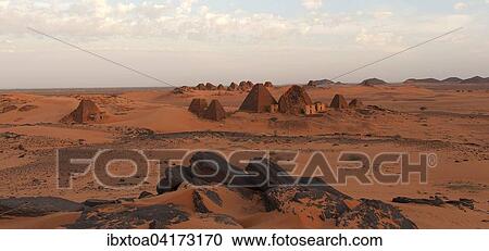 Stock Image - Pyramids of Meroe at sunrise, Nubian Desert, Nubia, Nahr an-Nil, Sudan, Africa. Fotosearch