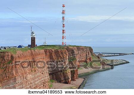 Red rock, cliff edge, at the sea with lighthouse and radio mast, Heligoland, Schleswig-Holstein, Germany, Europe View Large Photo Image Stock Image - Red rock, cliff edge, at the sea with lighthouse and radio mast, Heligoland, Schleswig-Holstein, Germany, Europe. Fotosearch