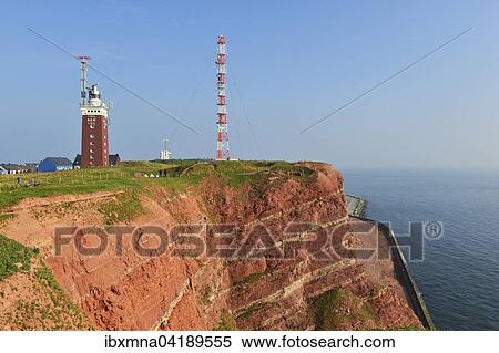 Red rock cliffs, transmission tower and lighthouse, Heligoland, Schleswig-Holstein, Germany, Europe View Large Photo Image Stock Photography - Red rock cliffs, transmission tower and lighthouse, Heligoland, Schleswig-Holstein, Germany, Europe. Fotosearch