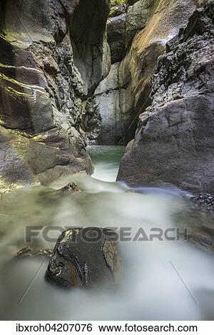 Tauglbach river flows through the Taugler Strubklamm, Taugl, Hallein District, Salzburg, Austria, Europe View Large Photo Image Stock Photograph - Tauglbach river flows through the Taugler Strubklamm, Taugl, Hallein District, Salzburg, Austria, Europe. Fotosearch