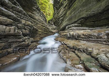Tauglbachs river flowing through the gorge, Taugl, Hallein District, Salzburg, Austria, Europe View Large Photo Image Stock Photo - Tauglbachs river flowing through the gorge, Taugl, Hallein District, Salzburg, Austria, Europe. Fotosearch