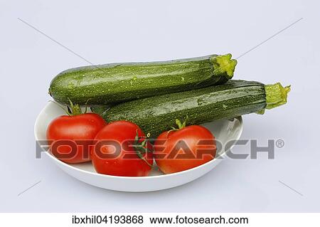 Tomatoes and zucchini View Large Photo Image Stock Photo - Tomatoes and zucchini. Fotosearch