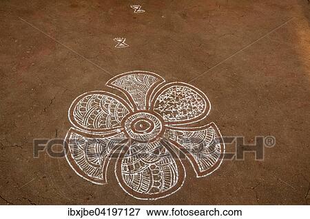 Traditional Rangoli, Kolam or Muggu, decorative pattern of colored sand on the ground, Jaisalmer, Rajasthan, India, Asia View Large Photo Image Stock Photo - Traditional Rangoli, Kolam or Muggu, decorative pattern of colored sand on the ground, Jaisalmer, Rajasthan, India, Asia. Fotosearch