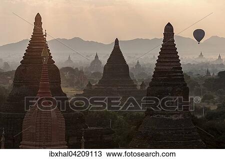 View of pagodas, temples, pagodas field, hot air balloon, sunrise, morning light, Bagan, Mandalay region, Myanmar, Asia View Large Photo Image Stock Image - View of pagodas, temples, pagodas field, hot air balloon, sunrise, morning light, Bagan, Mandalay region, Myanmar, Asia. Fotosearch