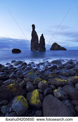 Stock Image - Volcanic rock formation Ilheus da Rib by the cliffs of Ribeira da Janela, Madeira, Portugal, Europe. Fotosearch
