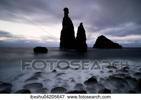 Stock Photo - Volcanic rock formation Ilheus da Rib by the cliffs of Ribeira da Janela, Madeira, Portugal, Europe. Fotosearch