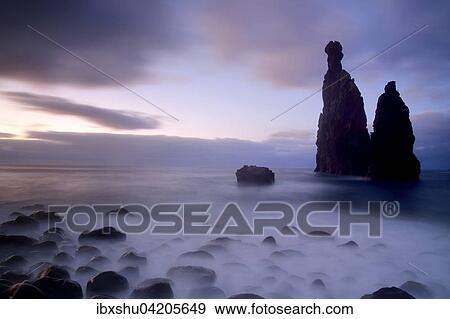 Stock Photo - Volcanic rock formation Ilheus da Rib by the cliffs of Ribeira da Janela, Madeira, Portugal, Europe. Fotosearch