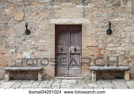 Wooden door and stone benches, Lucignano d'Asso, Tuscany, Province of Siena, Italy, Europe View Large Photo Image Picture - Wooden door and stone benches, Lucignano d'Asso, Tuscany, Province of Siena, Italy, Europe. Fotosearch