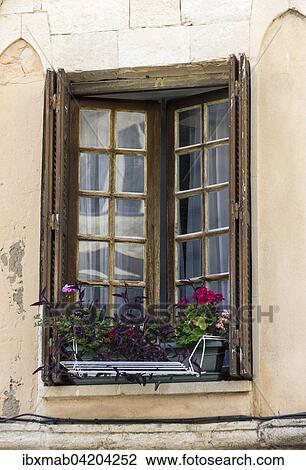 Stock Image - Wooden windows with flowers, Bonifacio, Corsica, France, Europe. Fotosearch
