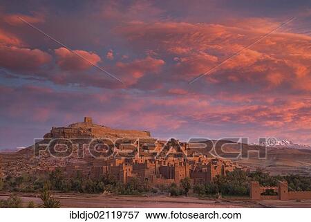 A spectacular sunrise above the Ksar, fortified city, of Aït Ben Haddou, UNESCO World Heritage Site, and the Ounila River on the eastern slope of the High Atlas mountains, Souss-Massa-Drâa, Morocco, Africa View Large Photo Image Stock Photo - A spectacular sunrise above the Ksar, fortified city, of Aït Ben Haddou, UNESCO World Heritage Site, and the Ounila River on the eastern slope of the High Atlas mountains, Souss-Massa-Drâa, Morocco, Africa. Fotosearch
