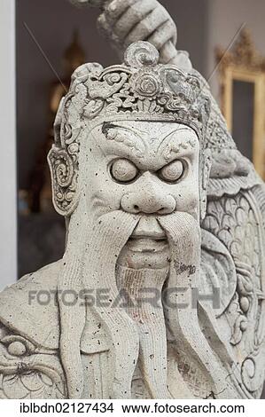 Picture - A stone guard statue at Wat Pho temple, Bangkok, Thailand, Asia. Fotosearch
