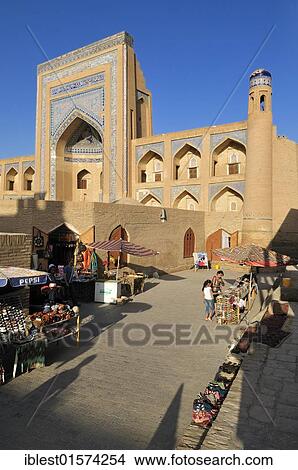 Allaquli Khan Madrasah, historic adobe town of Khiva, Chiva, Ichan Kala, Silk Road, Unesco World Heritage Site, Uzbekistan, Central Asia, Asia View Large Photo Image Picture - Allaquli Khan Madrasah, historic adobe town of Khiva, Chiva, Ichan Kala, Silk Road, Unesco World Heritage Site, Uzbekistan, Central Asia, Asia. Fotosearch