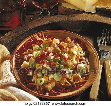Stock Photo - Appenzeller cheese salad with croutons, Swiss cheese, pear, bread cubes on radicchio, Switzerland, Europe. Fotosearch