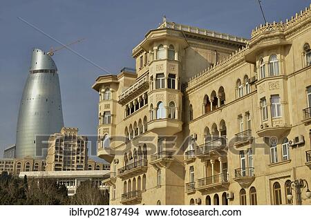 Picture - Art Nouveau facade at the beach promenade, Bulevar, in front of the facade of one of the high-rise towers of the three Flame Towers, the new landmark of the city, Baku, Azerbaijan, Caucasus, Middle East, Asia. Fotosearch