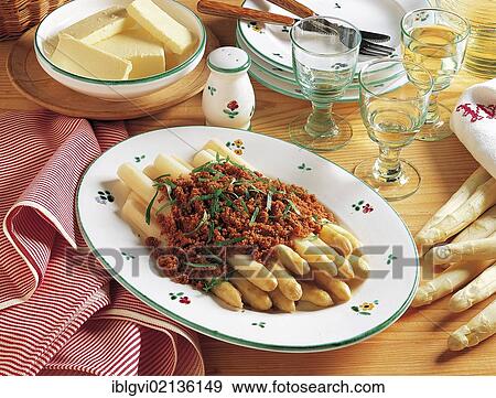 Stock Photo - Asparagus with butter crumbles, bread crumbs, butter and vegetables, Austria, Europe. Fotosearch