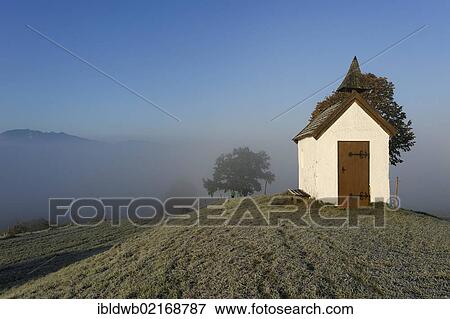 Stock Photo - Autumn morning fog near Aidling, Mesnerhauskapelle chapel, Pfaffenwinkel, Upper Bavaria, Bavaria, Germany, Europe. Fotosearch