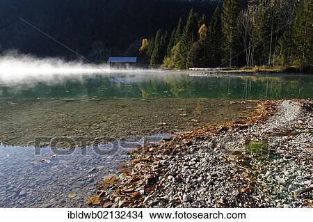 Autumnal morning mood on Lake Walchensee, at Obernach Canal, Upper Bavaria, Bavaria, Germany, Europe View Large Photo Image Picture - Autumnal morning mood on Lake Walchensee, at Obernach Canal, Upper Bavaria, Bavaria, Germany, Europe. Fotosearch