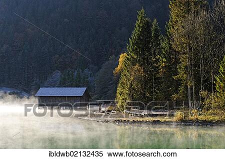 Autumnal morning mood on Lake Walchensee, at Obernach Canal, Upper Bavaria, Bavaria, Germany, Europe View Large Photo Image Stock Photography - Autumnal morning mood on Lake Walchensee, at Obernach Canal, Upper Bavaria, Bavaria, Germany, Europe. Fotosearch