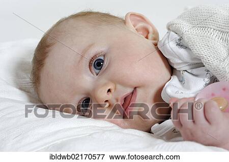 Baby, 6 month, smiling View Large Photo Image Stock Photo - Baby, 6 month, smiling. Fotosearch