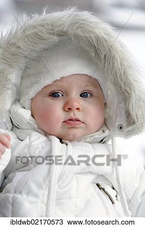 Baby, 6 month, wrapped in very warm winter clothing View Large Photo Image Stock Image - Baby, 6 month, wrapped in very warm winter clothing. Fotosearch