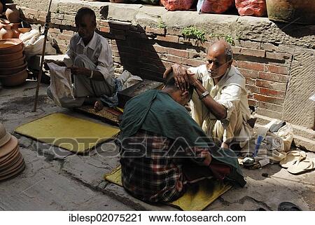 Barber cutting a man's hair on the street, Kathmandu, Nepal, Asia View Large Photo Image Stock Image - Barber cutting a man's hair on the street, Kathmandu, Nepal, Asia. Fotosearch