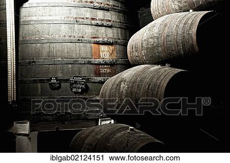 Stock Image - Barrels, Sandeman storehouse, Vila Nova de Gaia, Porto, Portugal, Europe. Fotosearch