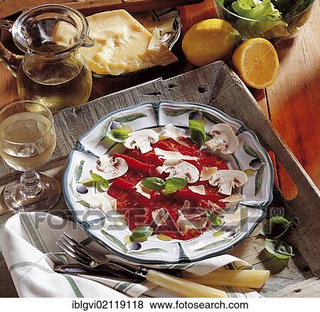Beef carpaccio, paper-thin beef fillet slices, sour olive dressing with mushrooms and Parmesan cheese shavings, cold starter, Italy, Europe View Large Photo Image Stock Photo - Beef carpaccio, paper-thin beef fillet slices, sour olive dressing with mushrooms and Parmesan cheese shavings, cold starter, Italy, Europe. Fotosearch