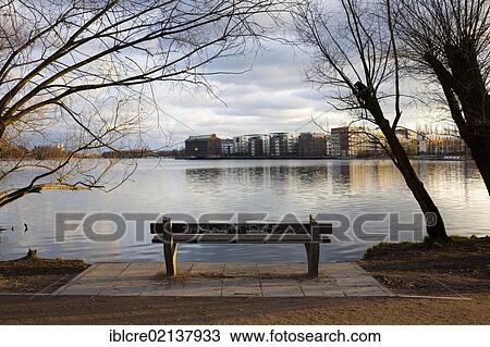 Stock Image - Bench on Rummelsburger See or Lake Rummelsburg, Rummelsburger Bucht bay, Rummelsburg, Lichtenberg, Berlin, Germany, Europe. Fotosearch