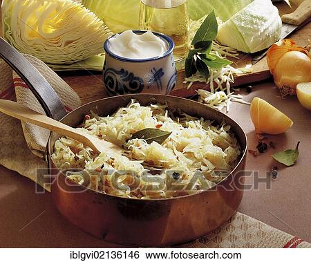 Stock Photograph - Berlin wine sauerkraut, bacon, onions, white wine, bay leaves, juniper, cloves and vegetables, Germany, Europe. Fotosearch