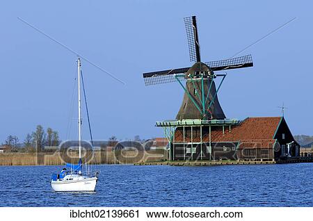 Boat and Windmill in Zaanse Schans open-air museum, Zaanstad, North Holland, Holland, Netherlands, Europe View Large Photo Image Stock Image - Boat and Windmill in Zaanse Schans open-air museum, Zaanstad, North Holland, Holland, Netherlands, Europe. Fotosearch