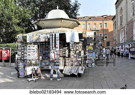 Picture - Booth selling souvenirs and newspapers at the Ponte dell'Academia, Venice, Veneto, Italy, Europe. Fotosearch