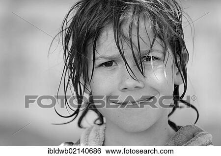 Stock Photograph - Boy with wet hair after swimming, smiling. Fotosearch