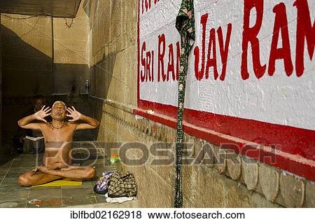 Brahmin man practising yoga near the holy river Ganges, Varanasi, Uttar Pradesh, India, Asia View Large Photo Image Stock Photo - Brahmin man practising yoga near the holy river Ganges, Varanasi, Uttar Pradesh, India, Asia. Fotosearch