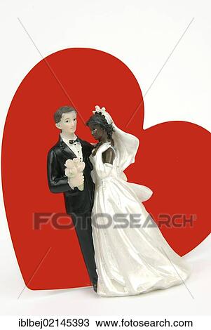Bridal couple figurines, red heart, symbolic image binational marriage View Large Photo Image Stock Image - Bridal couple figurines, red heart, symbolic image binational marriage. Fotosearch