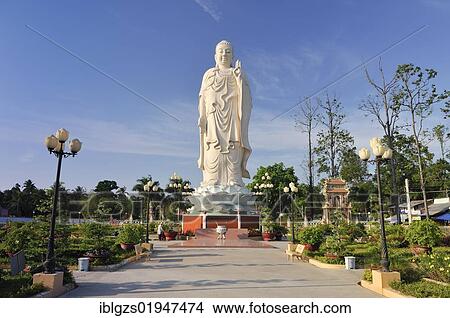 Picture - Buddha statue at Vinh Trang Pagoda, My Tho, Mekong Delta, Vietnam, Southeast Asia, Asia. Fotosearch