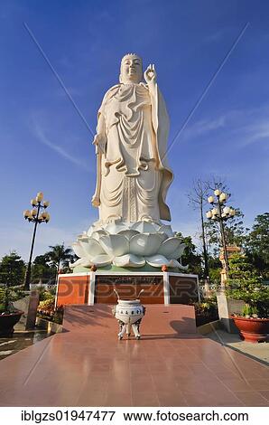 Stock Photo - Buddha statue at Vinh Trang Pagoda, My Tho, Mekong Delta, Vietnam, Southeast Asia, Asia. Fotosearch